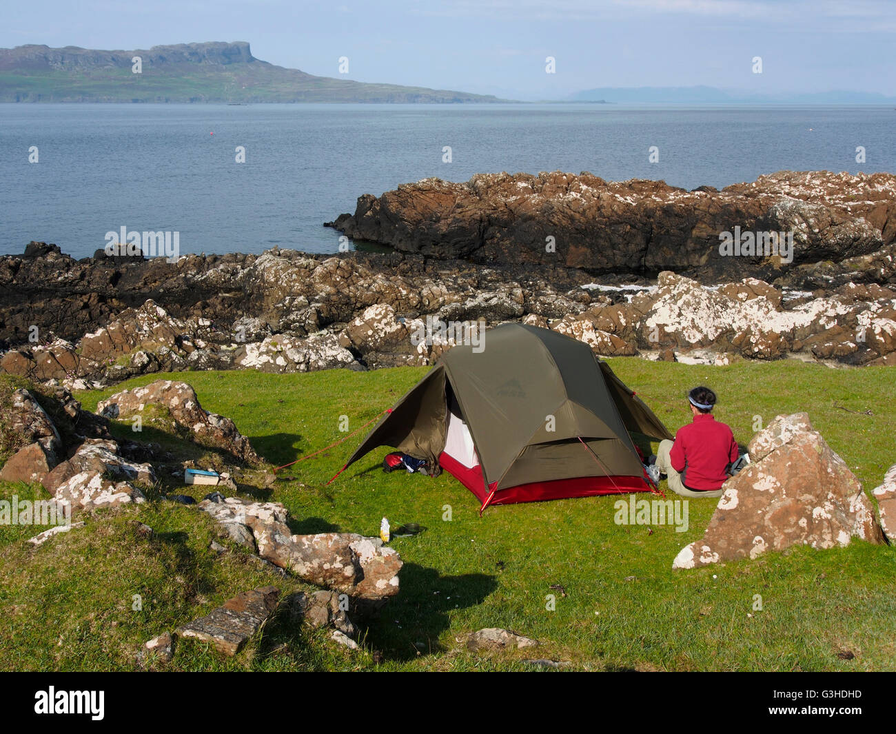 Wild camping, Isle of Muck, Scotland, with Eigg behind Stock Photo