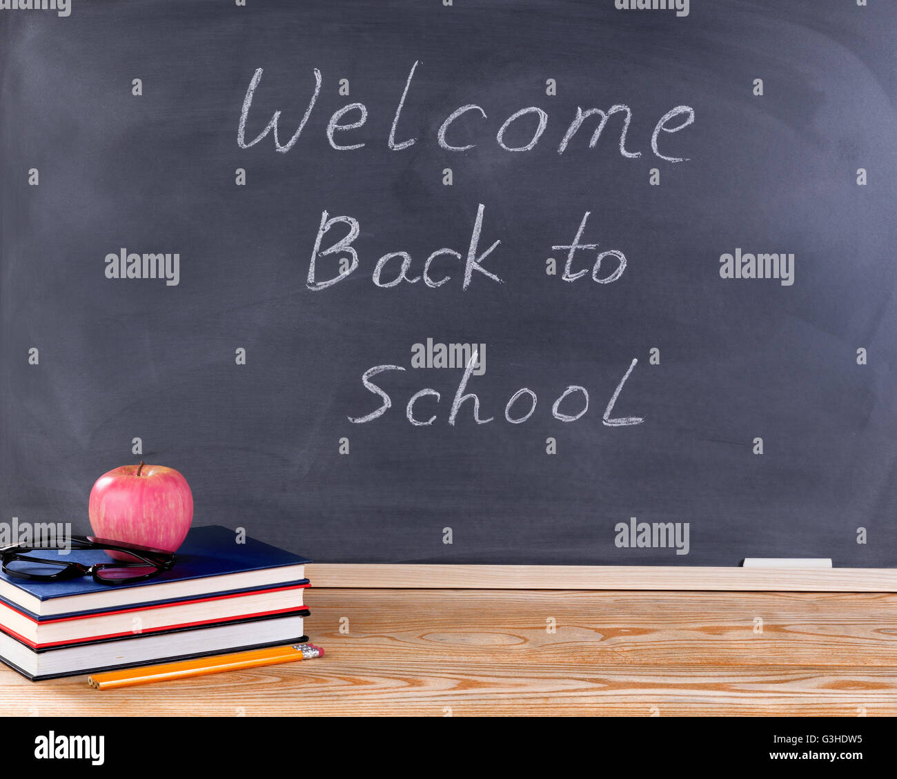Back to school concept with welcome back to school message on erased ...