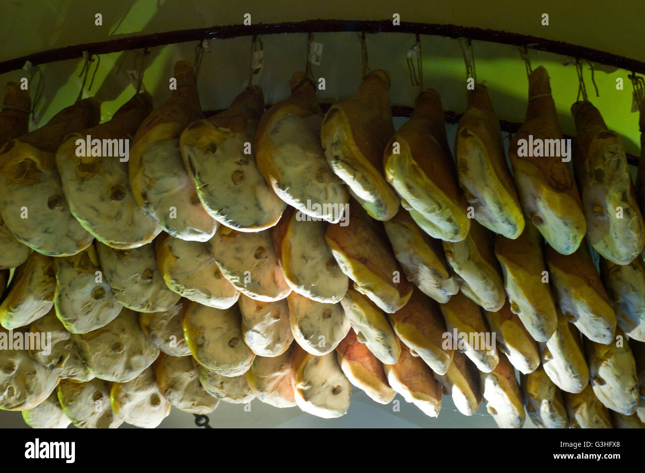 Hams for sale in a traditional Italian food shop, Rome  Italy. May 2016 Stock Photo