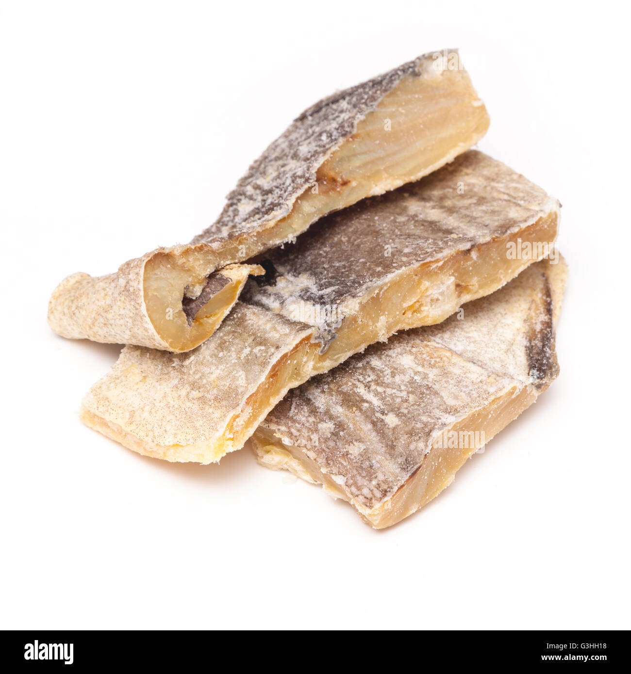 Portuguese Bacalhau traditional salt dried cod, isolated on a white studio background. Stock Photo