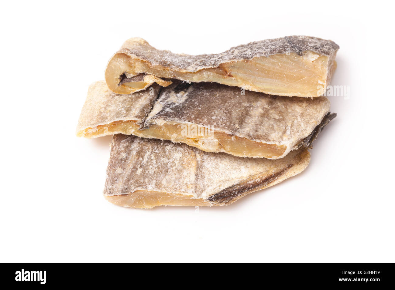 Portuguese Bacalhau traditional salt dried cod, isolated on a white studio background. Stock Photo