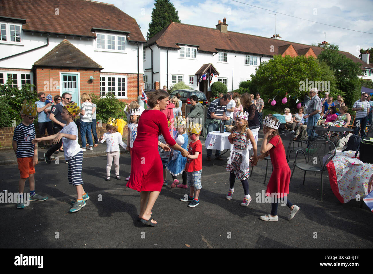 Queen Elizabeth II 90th birthday celebrations, people take part in a street party in Claygate, Surrey, England, UK Stock Photo