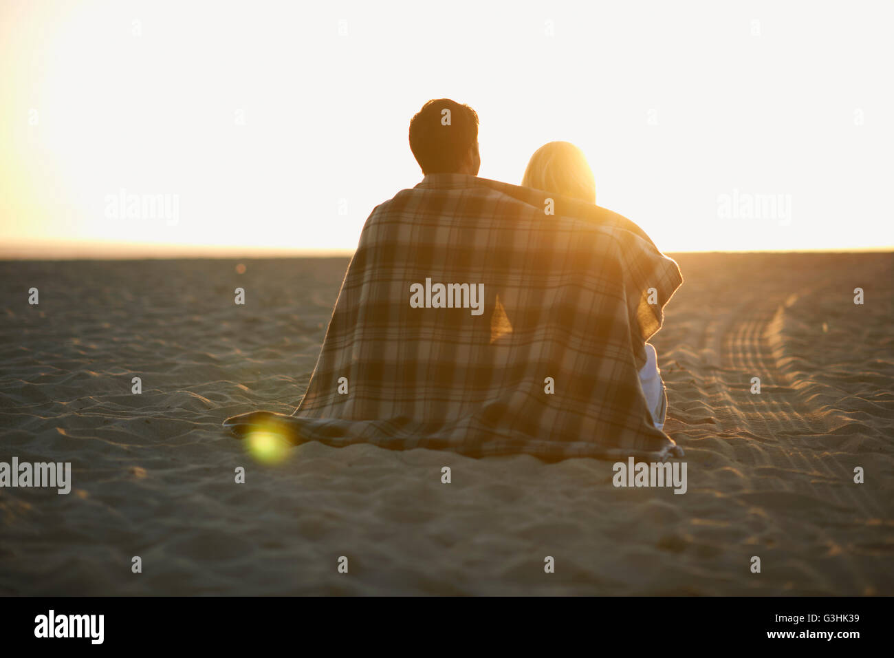 Man watching woman on beach hi-res stock photography and images - Alamy