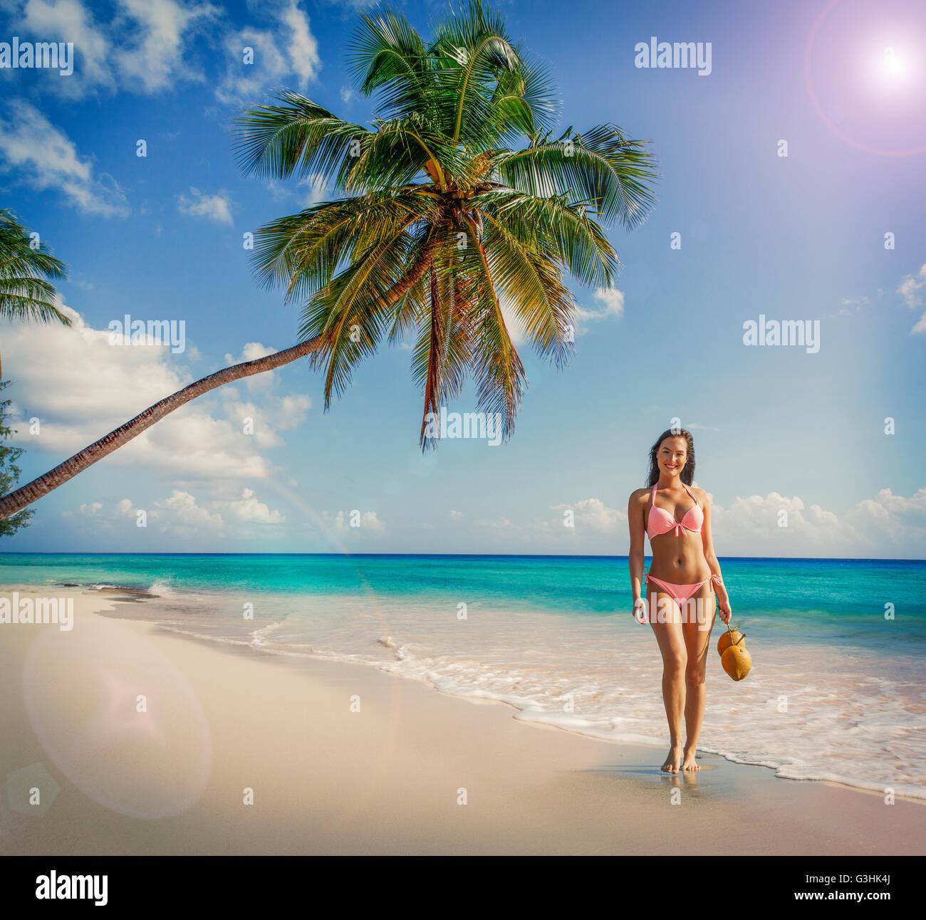 Portrait of young woman wearing bikini standing on Miami beach, Florida, USA Stock Photo