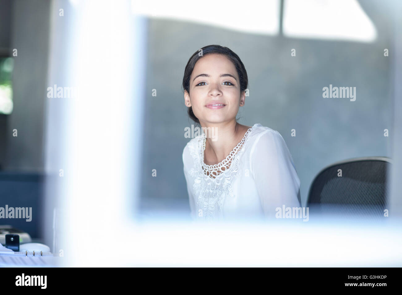 Portrait of businesswoman working at office desk Stock Photo - Alamy