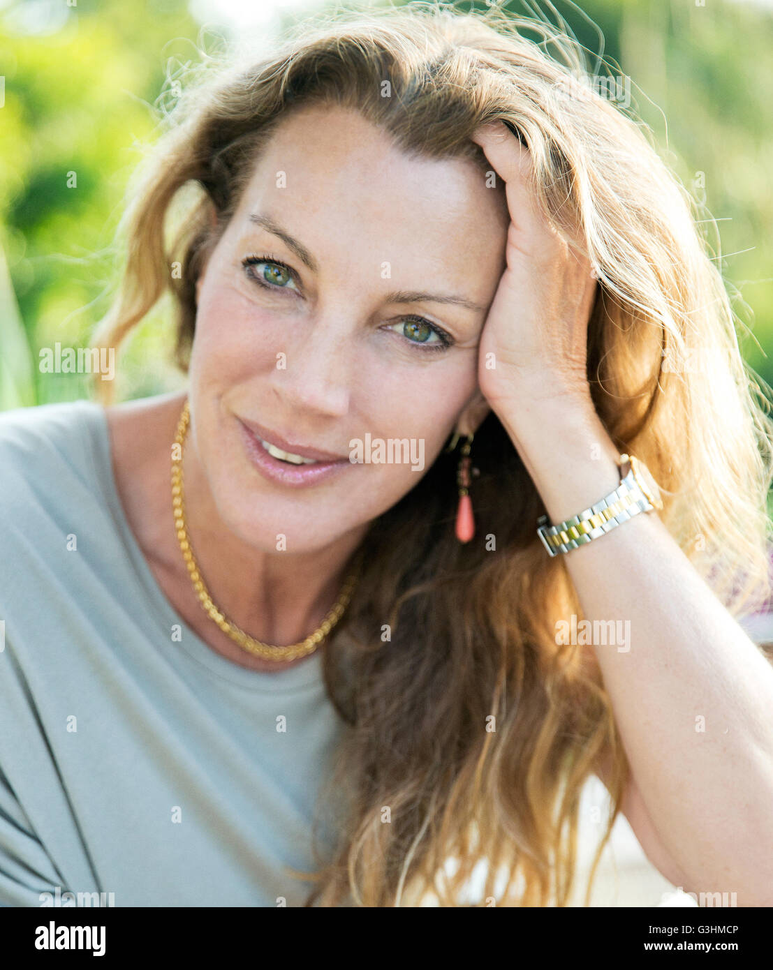 Close up portrait of beautiful mature woman with long blond hair Stock Photo