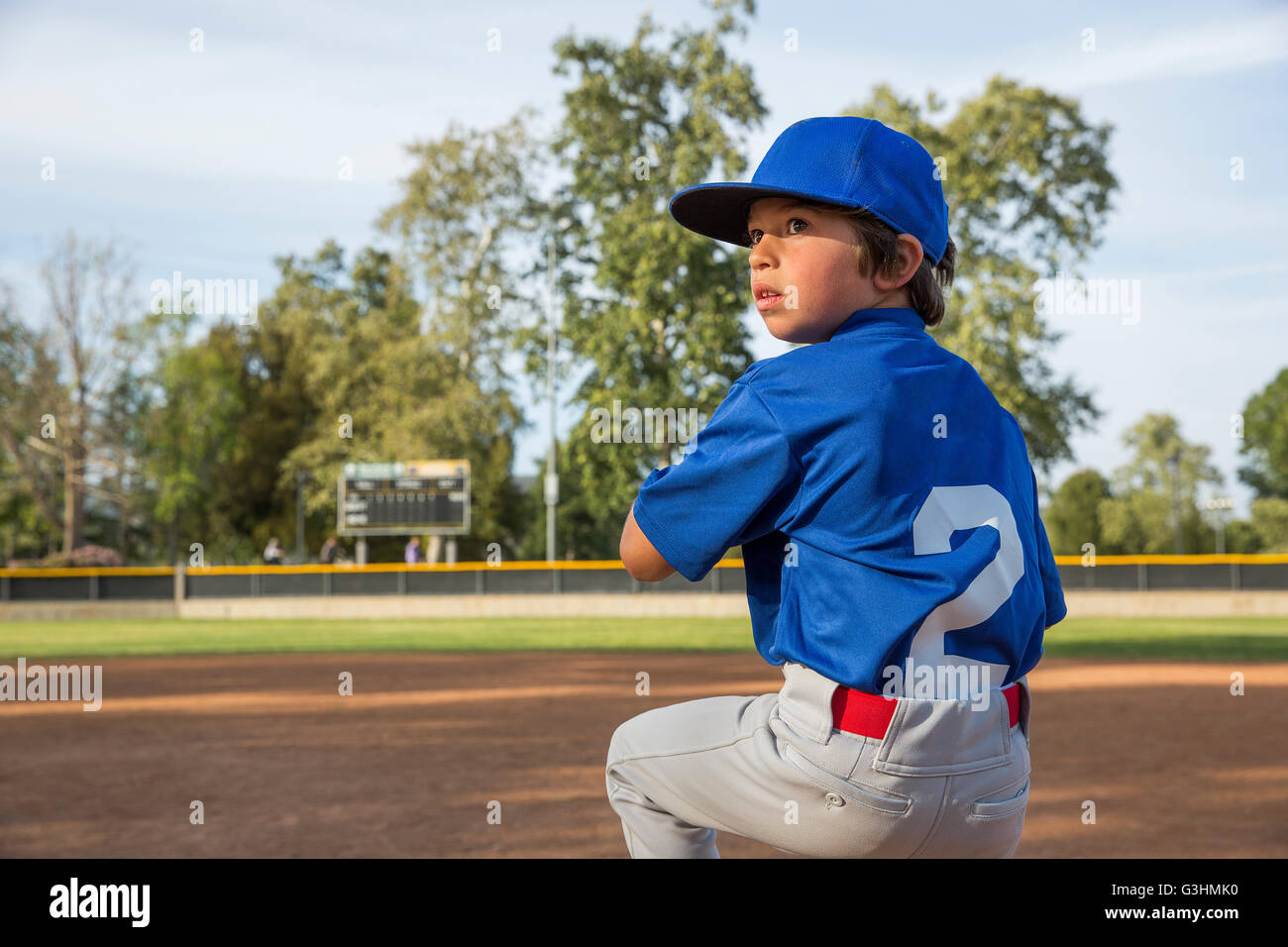 Boy throwing ball at practise on baseball field Stock Photo Alamy