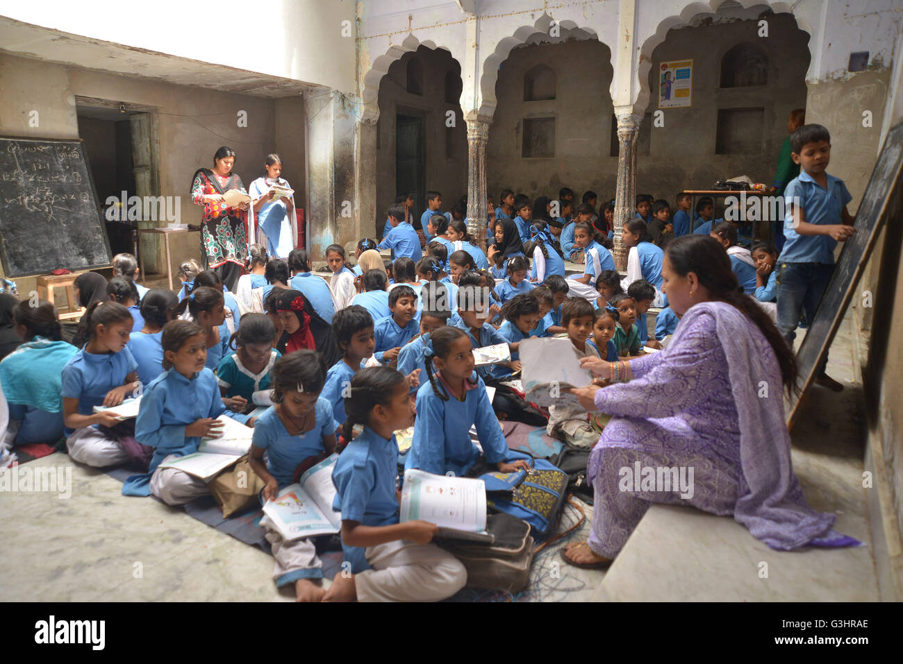 This government school of Muslim for girls has no shed no electricity, established in 1940. This girls school in Anderkot, Ajmer operating out of a rented building since then, they had no electricity, has a high dropout rate and only three teachers for 210 students enrolled in class. It's literally a courtyard in the name of a school, 50 square meters in size where three classes are conducted at the same time, even students of other classes wait in two small rooms for their turn and students sit directly under the sun in that open courtyard. (Photo by Shaukat Ahmed/Pacific Press) Stock Photo