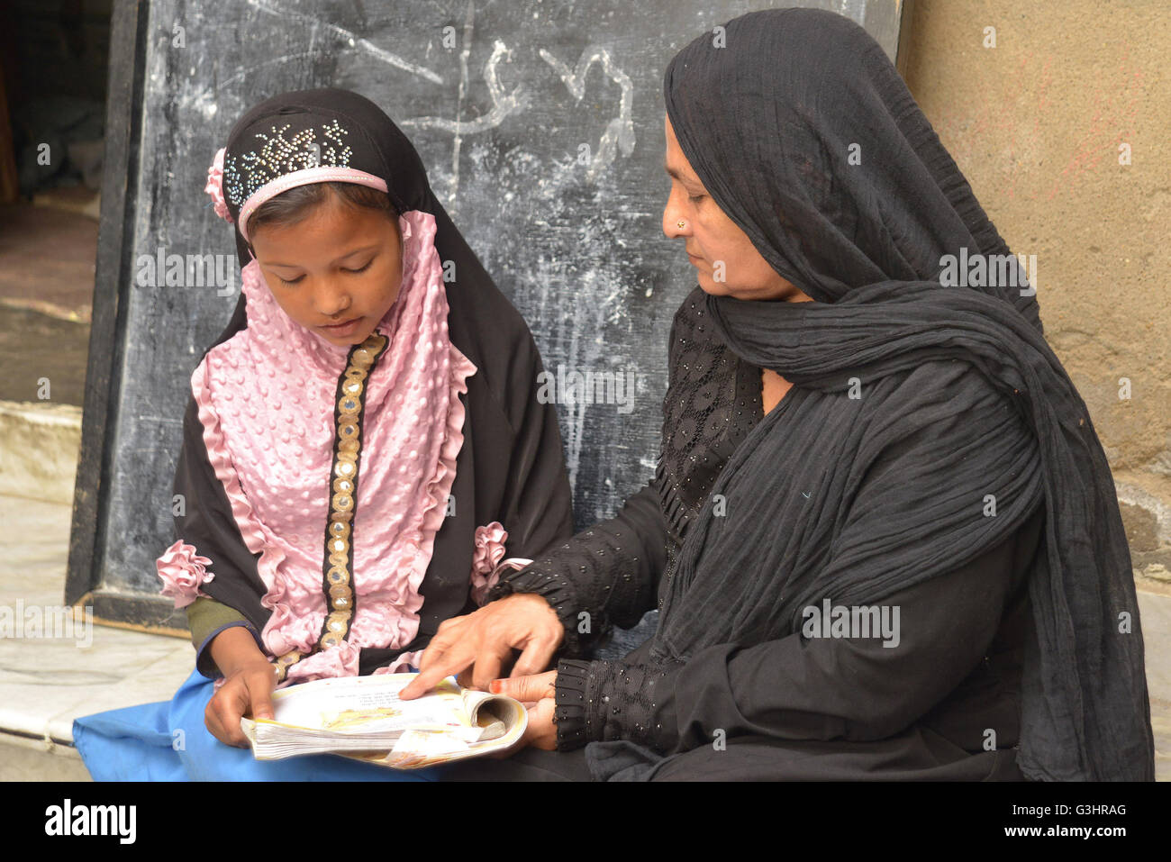 This government school of Muslim for girls has no shed no electricity, established in 1940. This girls school in Anderkot, Ajmer operating out of a rented building since then, they had no electricity, has a high dropout rate and only three teachers for 210 students enrolled in class. It's literally a courtyard in the name of a school, 50 square meters in size where three classes are conducted at the same time, even students of other classes wait in two small rooms for their turn and students sit directly under the sun in that open courtyard. (Photo by Shaukat Ahmed/Pacific Press) Stock Photo