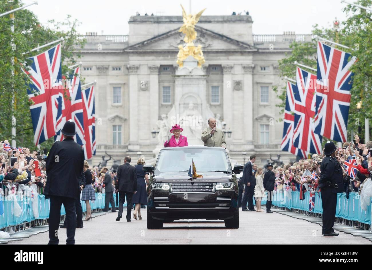 Queen Elizabeth II and the Duke of Edinburgh arrive at the Patron's Lunch in The Mall, central London in honour of the her 90th birthday, in an open topped Range Rover. Stock Photo