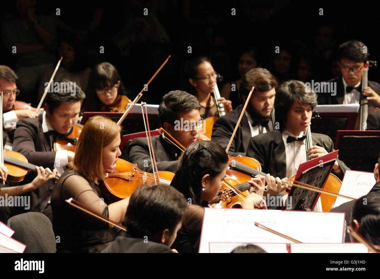 The violin players in an intense play during one composition. A full decade away from being a century old, the Manila Symphony Orchestra turns to Russian Romanticism to celebrate their landmark year. Led by Maestro Arturo Molina, the orchestra will be performing masterpieces by two of the five great composers from 19th Century Russia, namely Aleksandr Borodin and Modest Mussorgsky at the Power Mac Center Spotlight at Circuit Makati. (Photo by George Buid / Pacific Press) Stock Photo