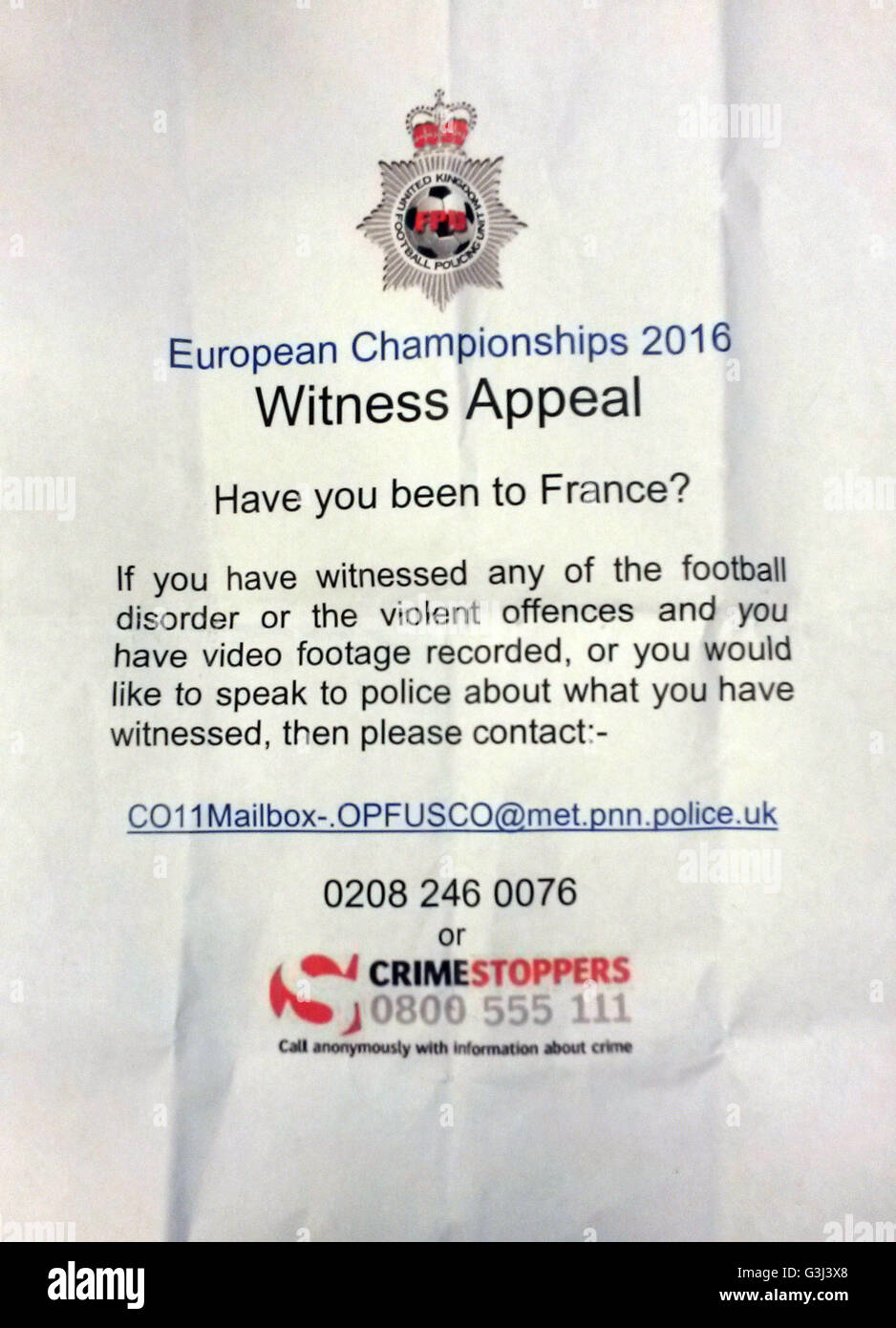 The leaflet being handed out at St Pancras International rail station in London for a witness appeal after violence flared between England supporters, Russians and local French hooligans in Marseille before and after the Euro 2016 match between England and Russia. Stock Photo