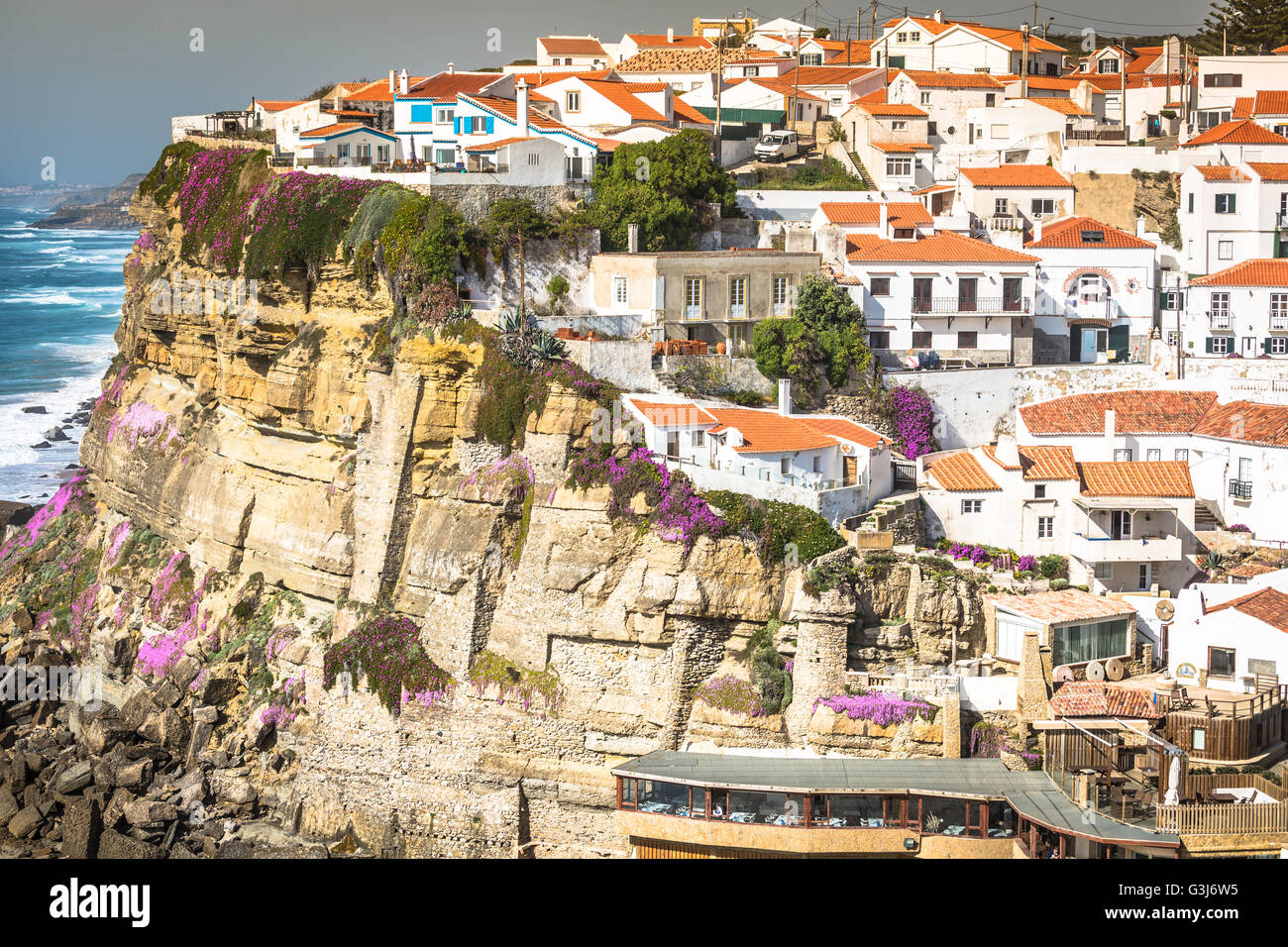 Azenhas do Mar white village landmark on the cliff and Atlantic ocean