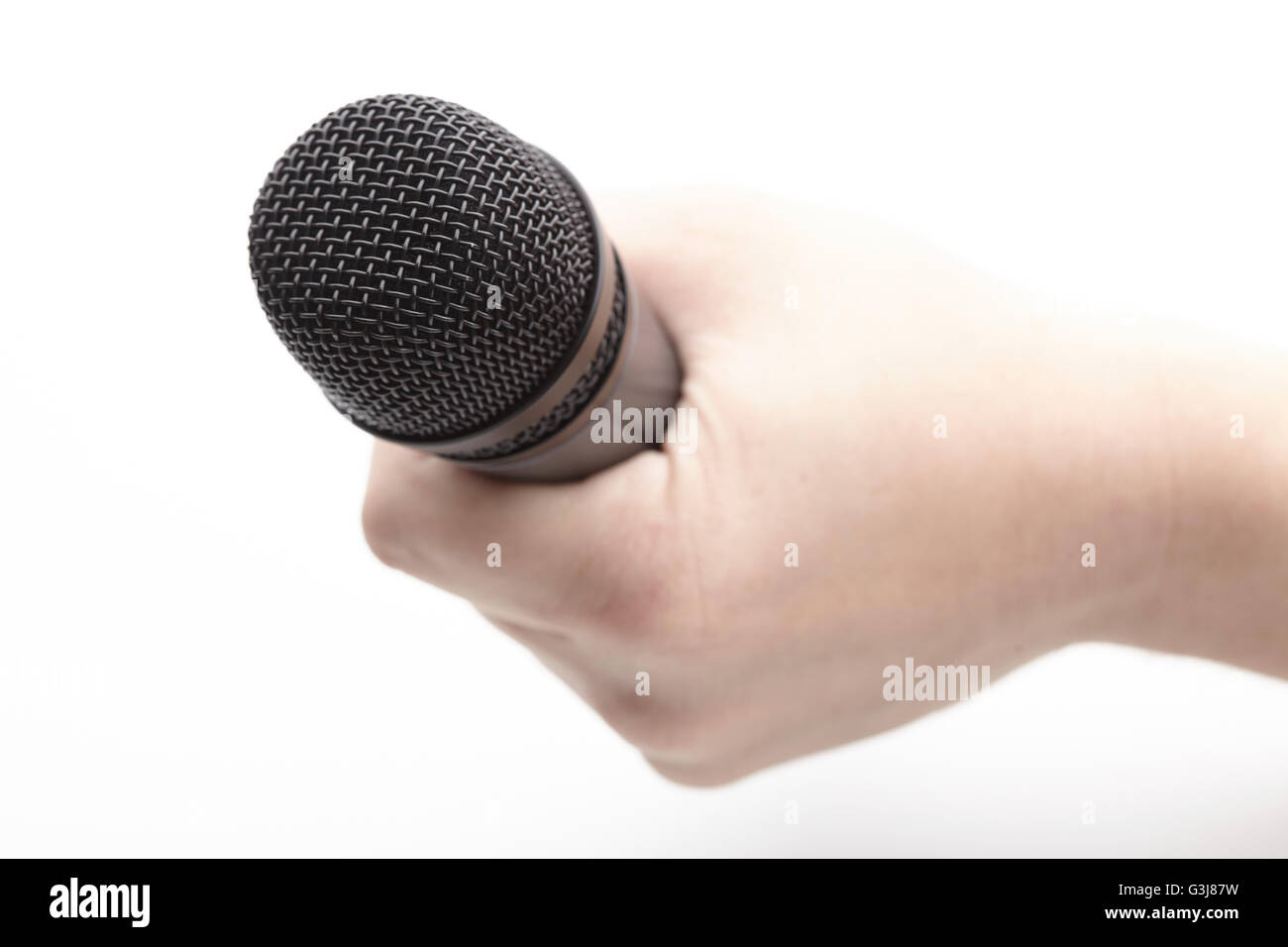 Microphone in a man's hand Stock Photo - Alamy