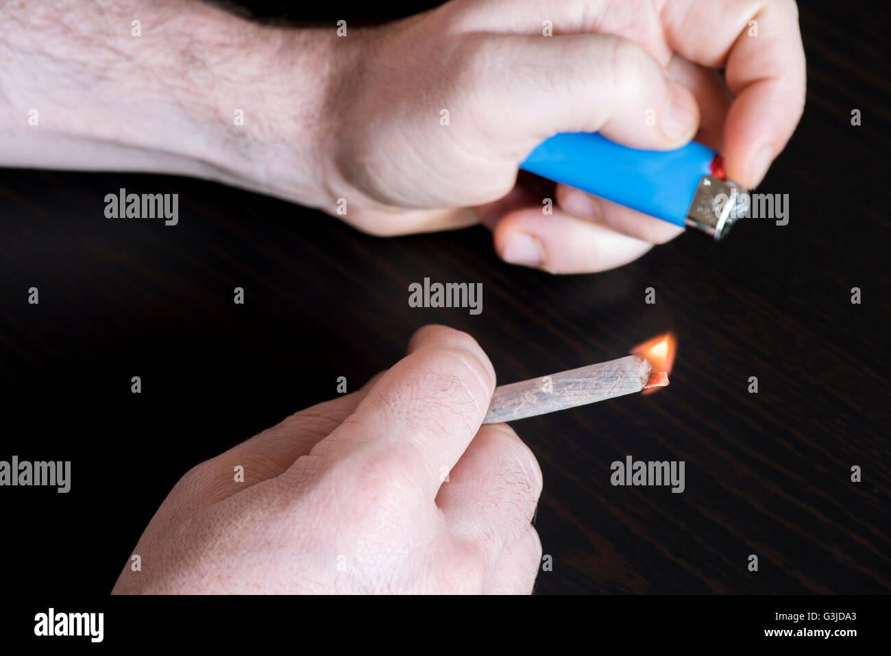 Cigarette and hands, nicotine addiction Stock Photo