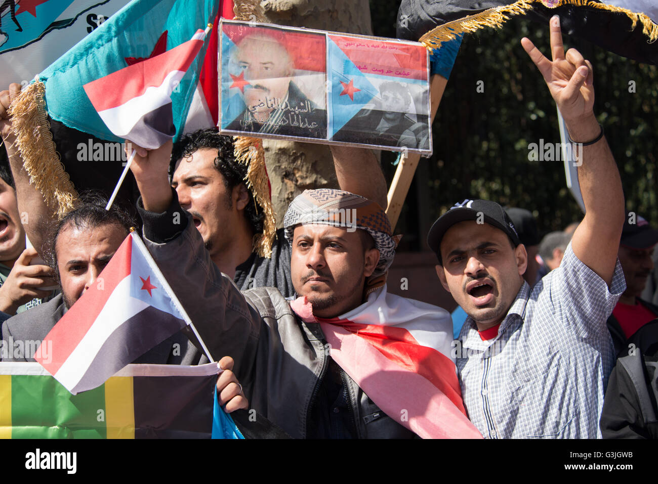 New York, United States. 18th Apr, 2016. Demonstrators wave flags and chant while participating in the rally. Amid the delay of United Nations-brokered peace talks between ex-Yemeni President Ali Abdullah Saleh and Houthi representatives due to have begun in Kuwait, and continued military engagement of Houthi-forces by a Saudi-led coalition; demonstrators gathered in Dag Hammarskjold Plaza near UN HQ in New York City to demand restoration of independence for South Yemen in solidarity with similar protests in Aden, Yemen over the past two days. © Albin Lohr-Jones/Pacific Press/Alamy Live News Stock Photo