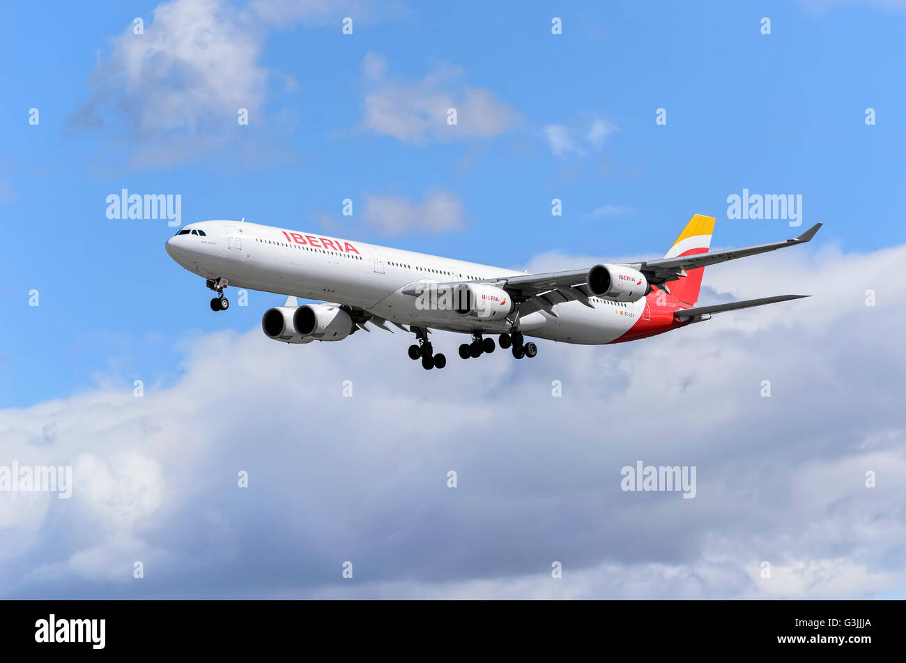 Airliner -Airbus A340-, of spanish airline -Iberia-, is coming, ready to land, to Madrid Barajas airport (Spain) Stock Photo