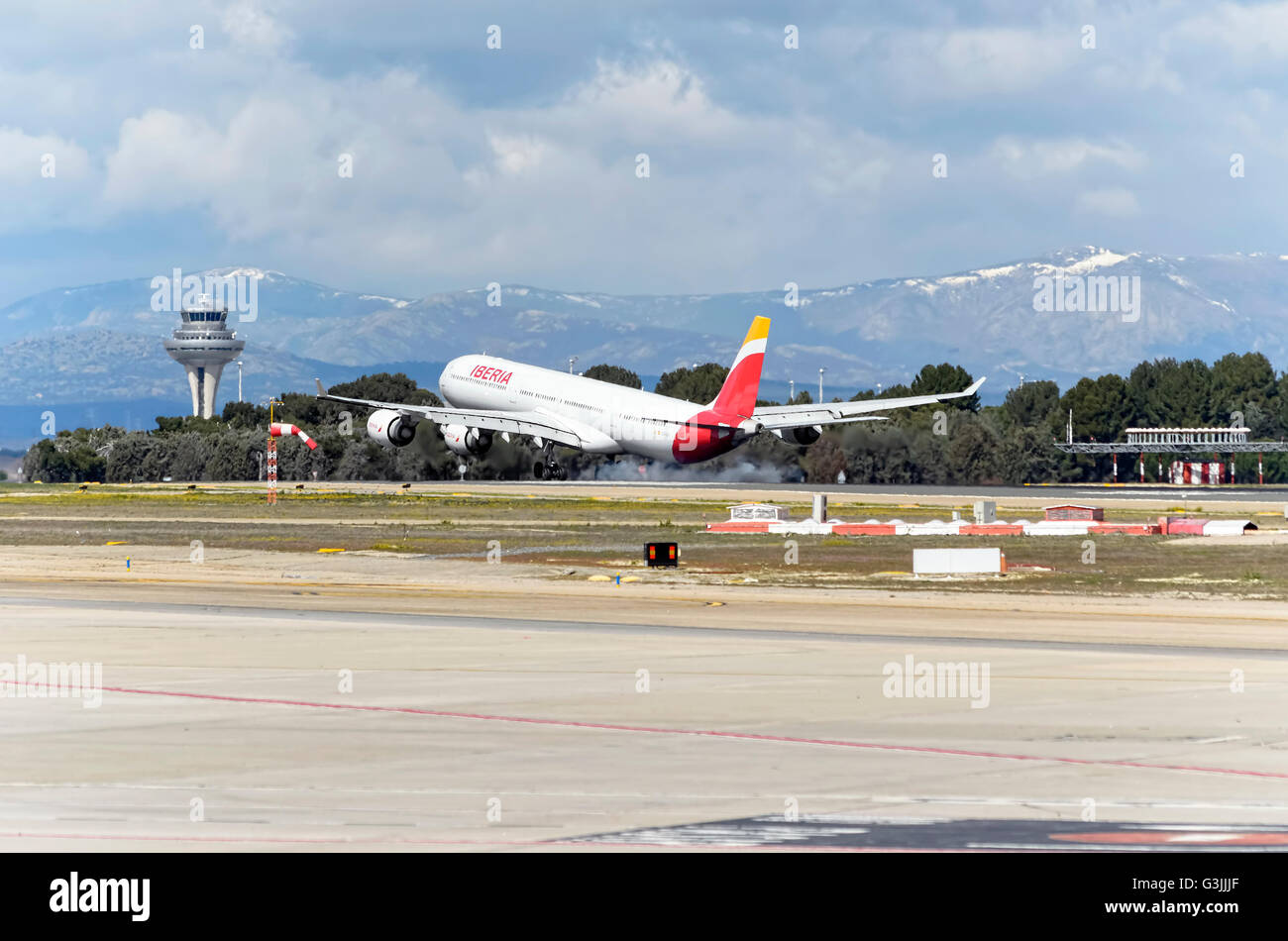 Airliner -Airbus A340-, of spanish airline -Iberia-, is landing in Madrid Barajas airport (Spain) Stock Photo