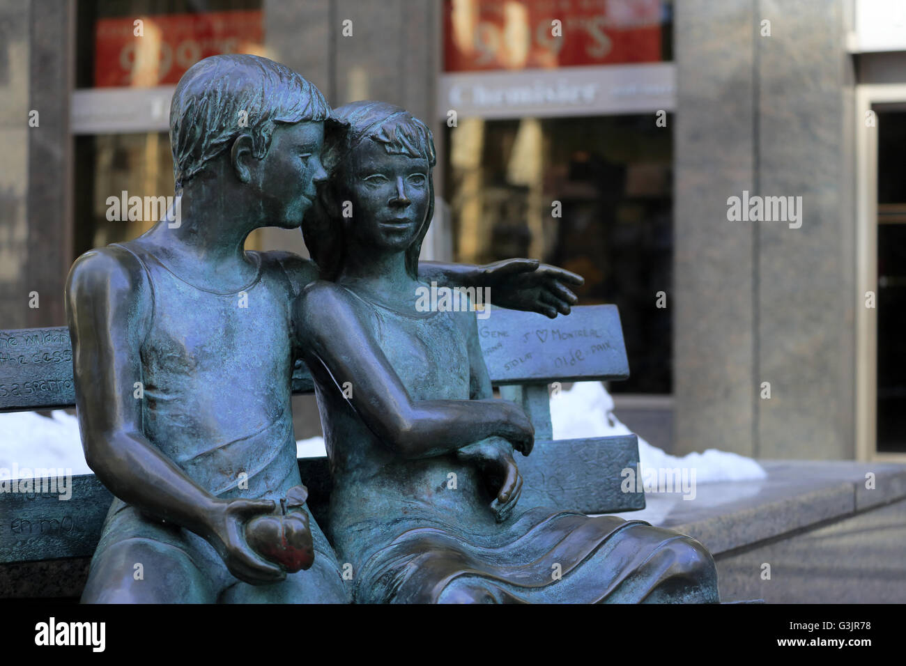 The sculpture of the Secret Bench of Knowledge by Sculptor Iea Vivot on sidewalk of Ave McGill College,Montreal,Quebec,Canada Stock Photo