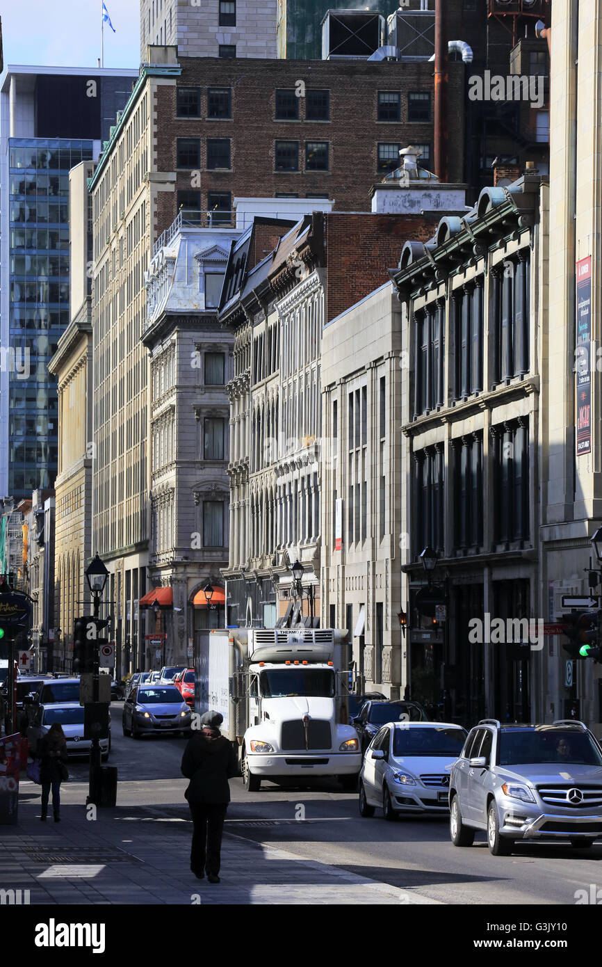 Street view of Old Montreal with Art Deco Aldred Building in the