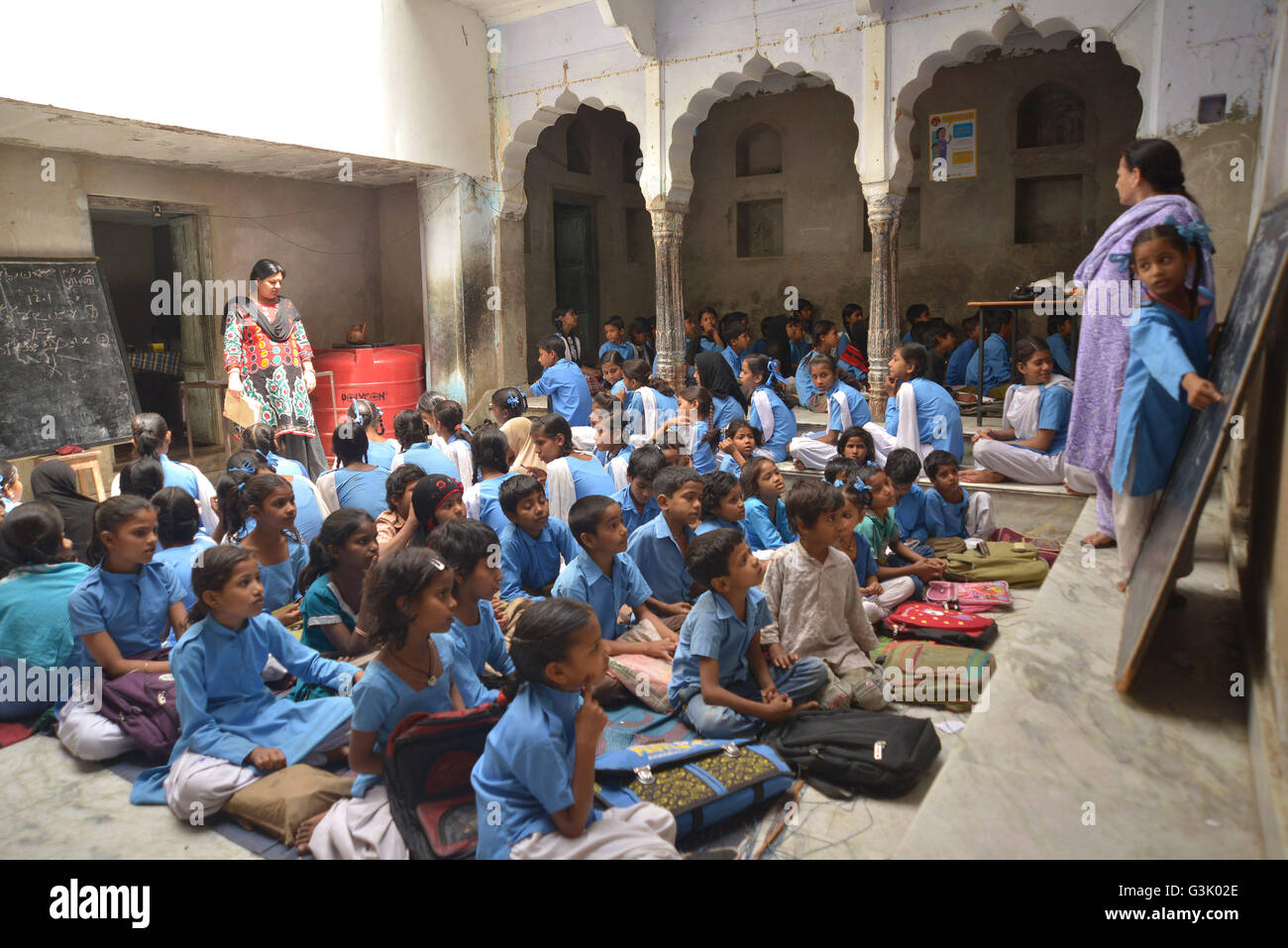 This government school of Muslim for girls has no shed no electricity, established in 1940. This girls school in Anderkot, Ajmer operating out of a rented building since then, they had no electricity, has a high dropout rate and only three teachers for 210 students enrolled in class. It's literally a courtyard in the name of a school, 50 square meters in size where three classes are conducted at the same time, even students of other classes wait in two small rooms for their turn and students sit directly under the sun in that open courtyard. (Photo by Shaukat Ahmed/Pacific Press) Stock Photo