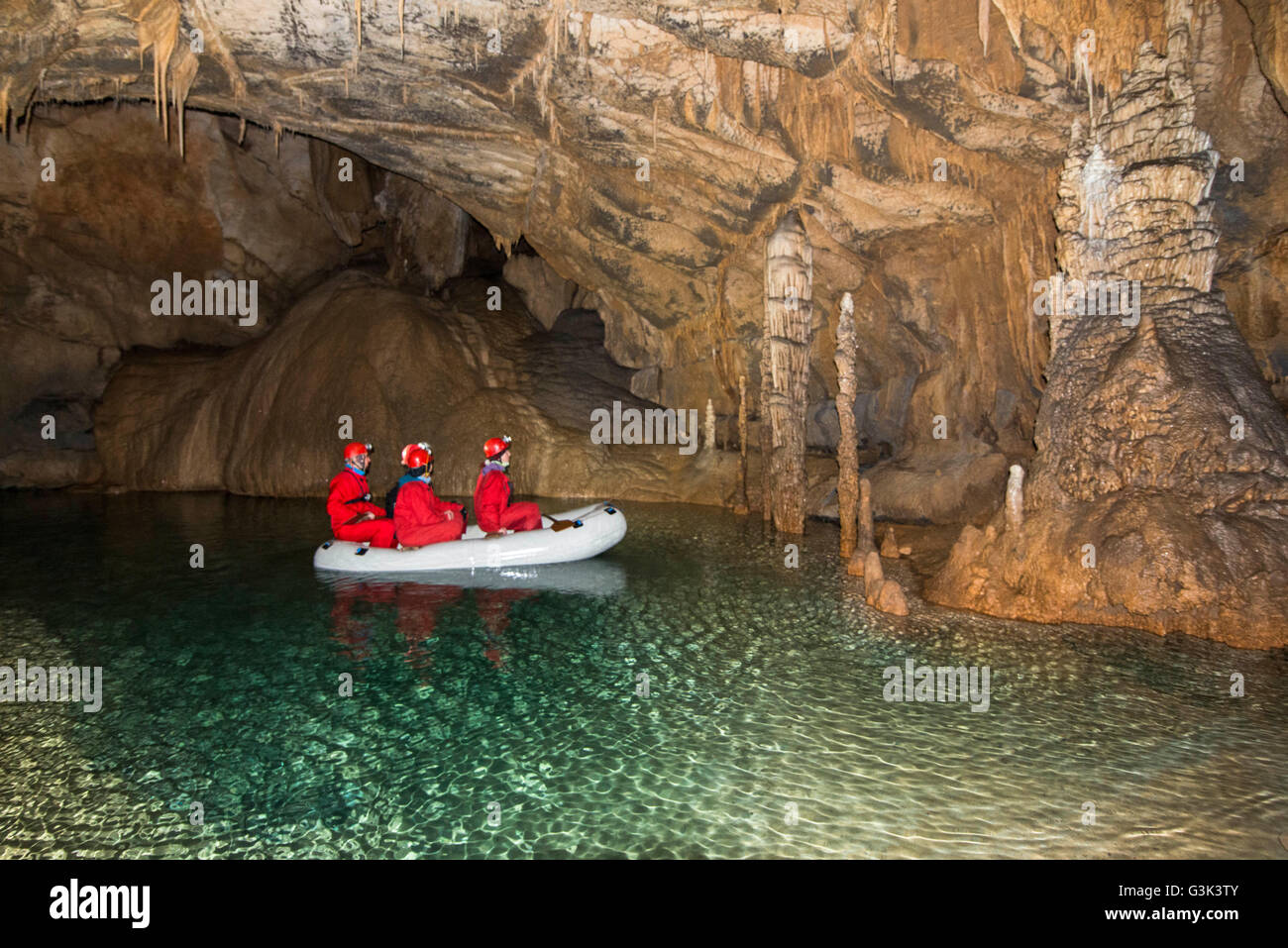 Exploring the cave Stock Photo - Alamy