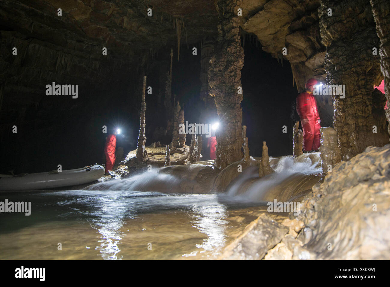 Exploring the cave Stock Photo - Alamy