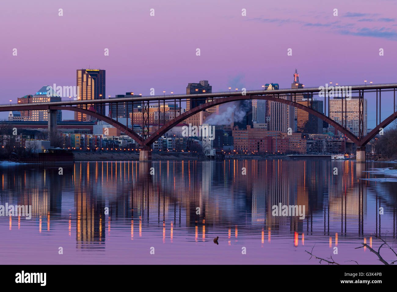 Saint Paul, Minnesota skyline at dusk with the Smith Ave High Bridge in the foreground. Stock Photo