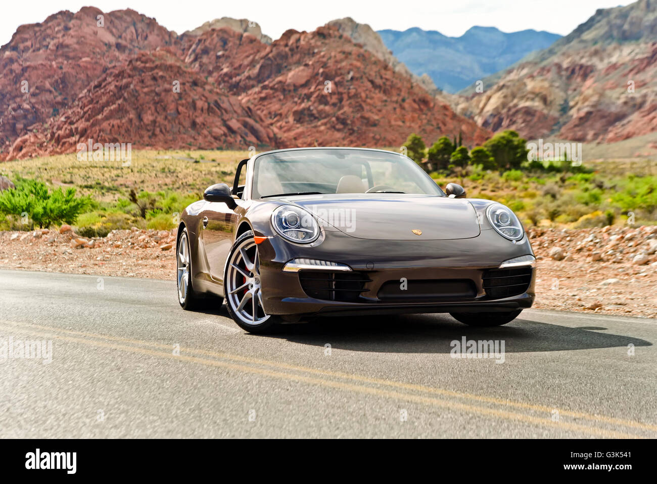 Front view of a Porsche 911 Carrera car on a desert road Stock Photo
