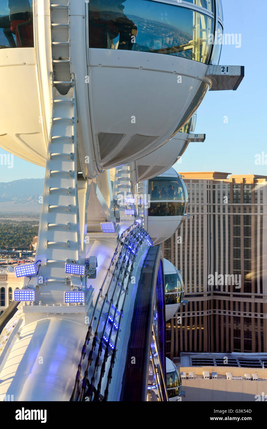 Observation cabins of the High Roller a 550-foot-tall Ferris wheel at twilight, With the Las Vegas skyline in background. Stock Photo