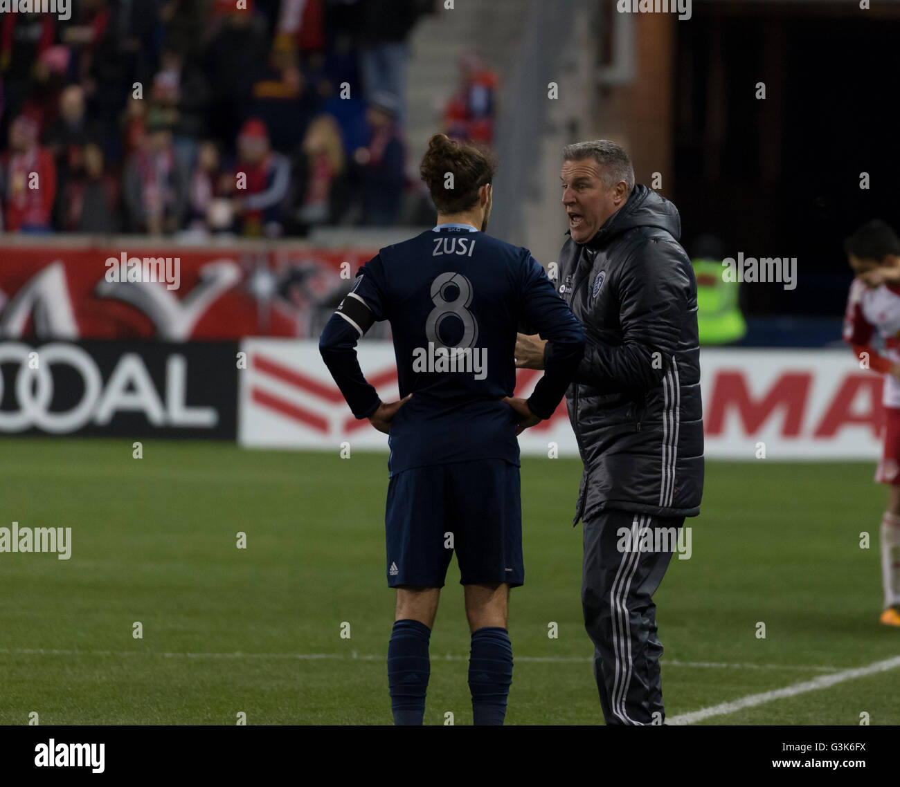 Harrison, United States. 09th Apr, 2016. Sporting Kansas City head couch talks to captain Graham Zusi during MLS soccer game against New York Red Bulls at Red Bull Arena © Lev Radin/Pacific Press/Alamy Live News Stock Photo