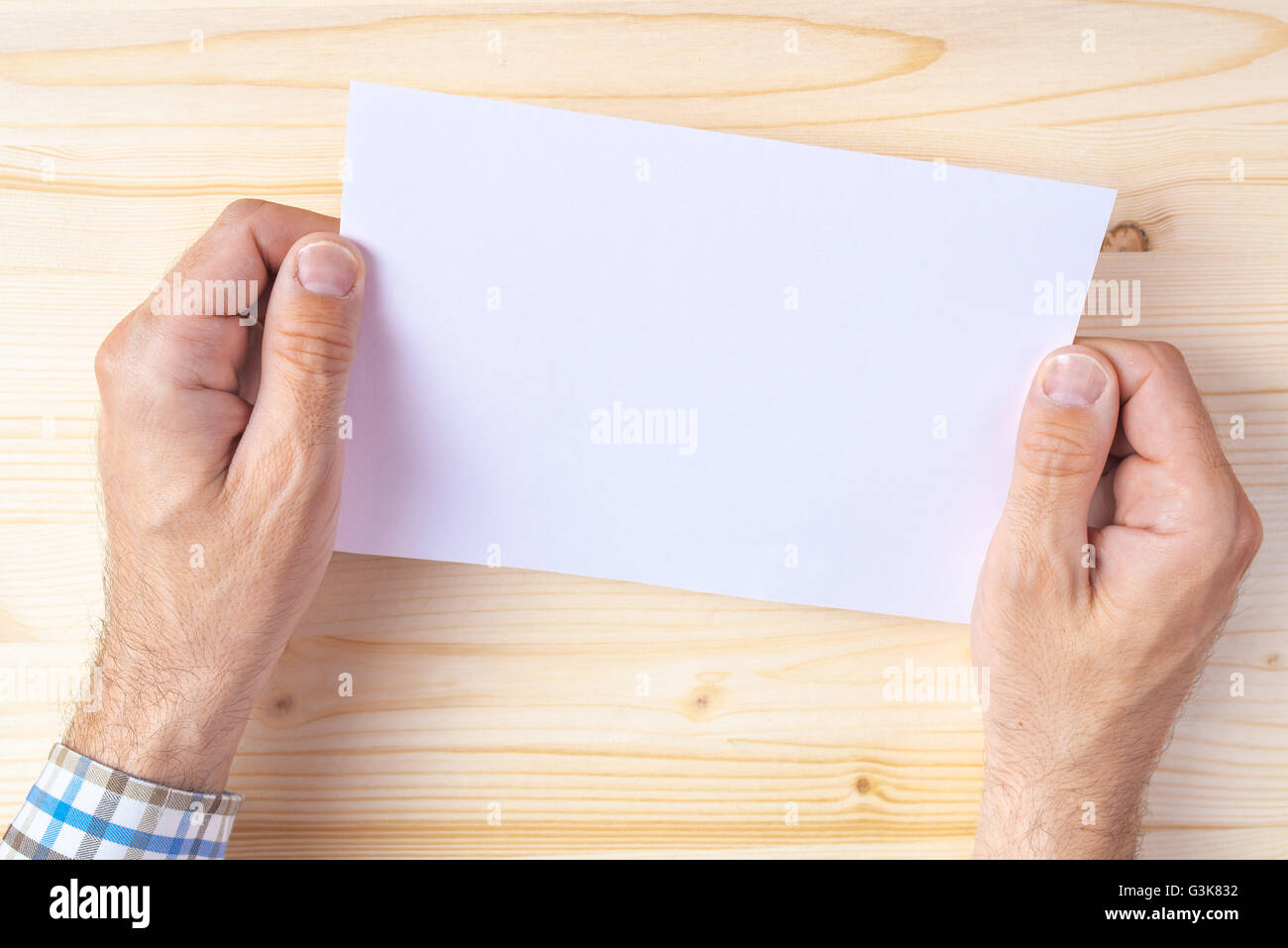 Man holding blank brochure as mock up copy space for graphic design or text placement Stock Photo