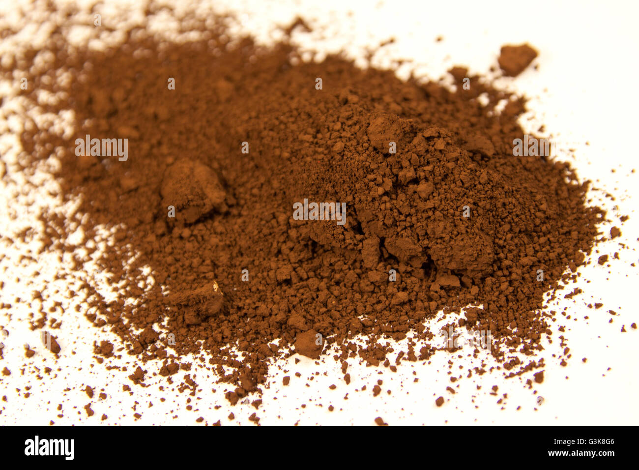 Umber Piments close up of a small portion of burnt umber pigment isolated over white ...