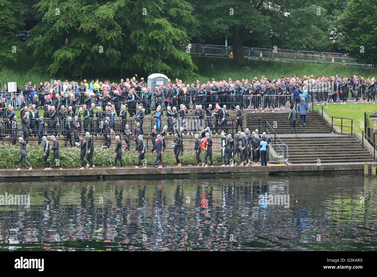 Hundreds of triathletes line up ready for the swim waves in Roundhay Park Lake at World Series Triathlon, Leeds. Stock Photo