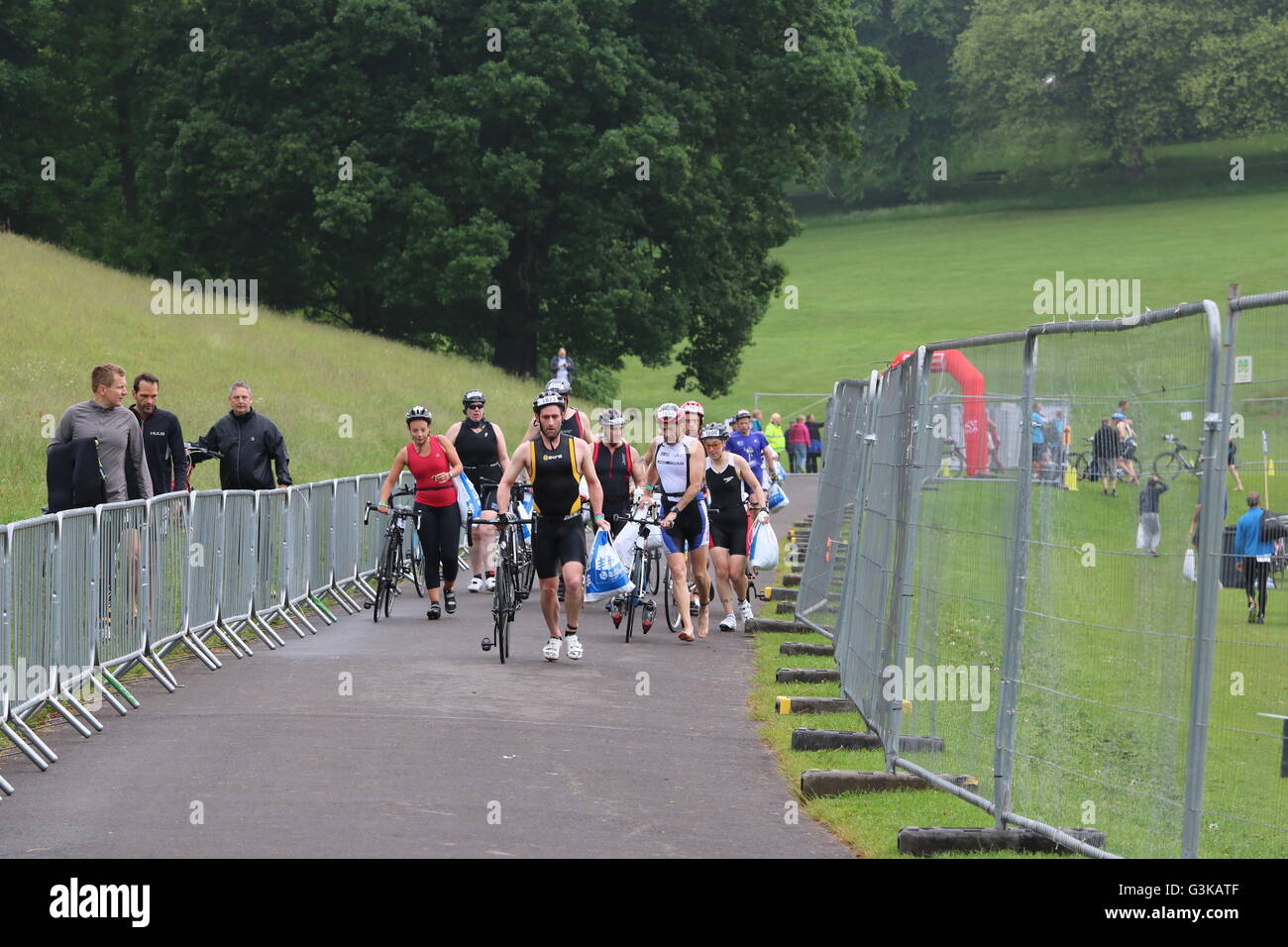 Triathletes leave bike transition in Roundhay Park during the open race category at World Series Triathlon, Leeds. Stock Photo