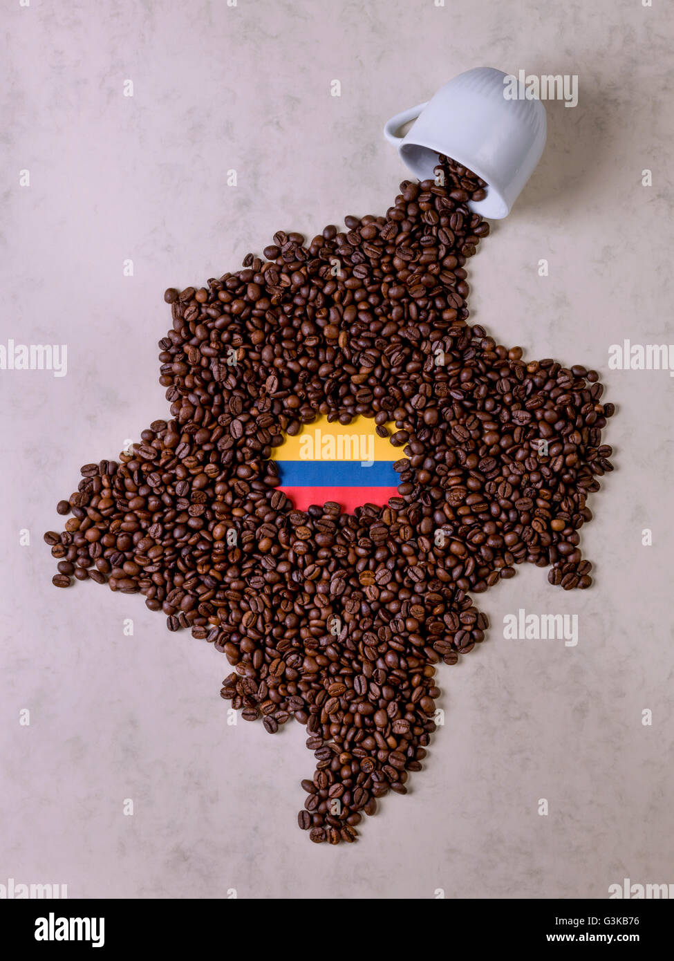 Fall cup coffee, coffee beans forming the map of Colombia Stock Photo