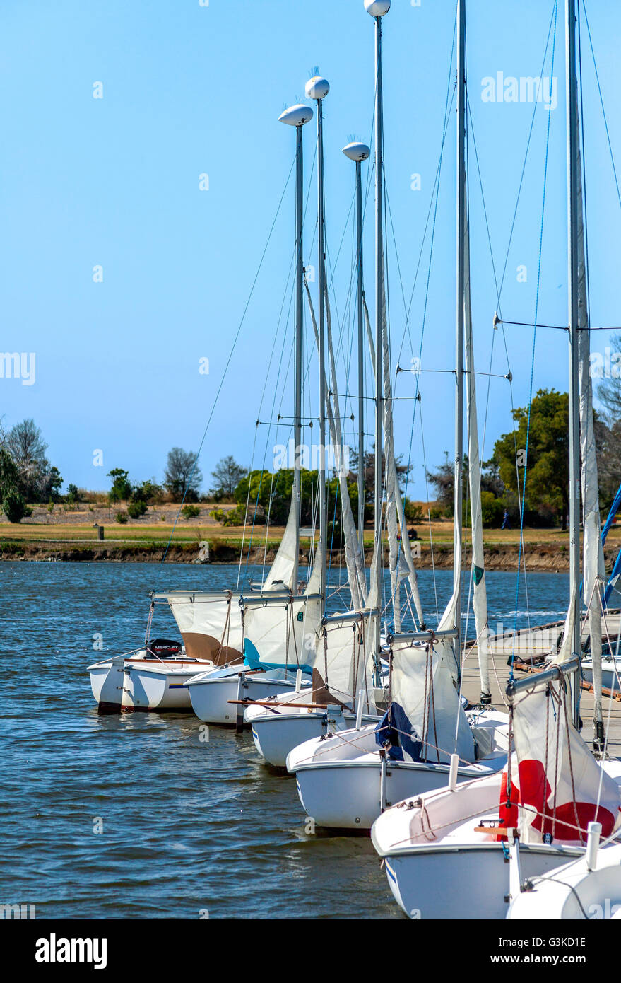 A line of boats docked on the pier Stock Photo - Alamy