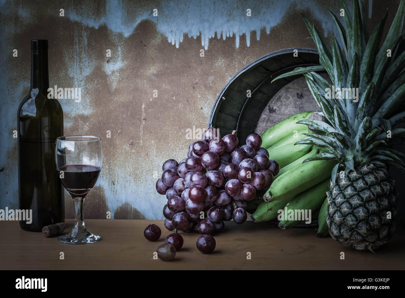 Fruits and wine on the old of background and rusty. Stock Photo