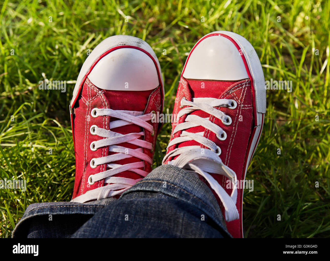 Feet in dirty red sneakers outdoors. Making first step Stock Photo Alamy