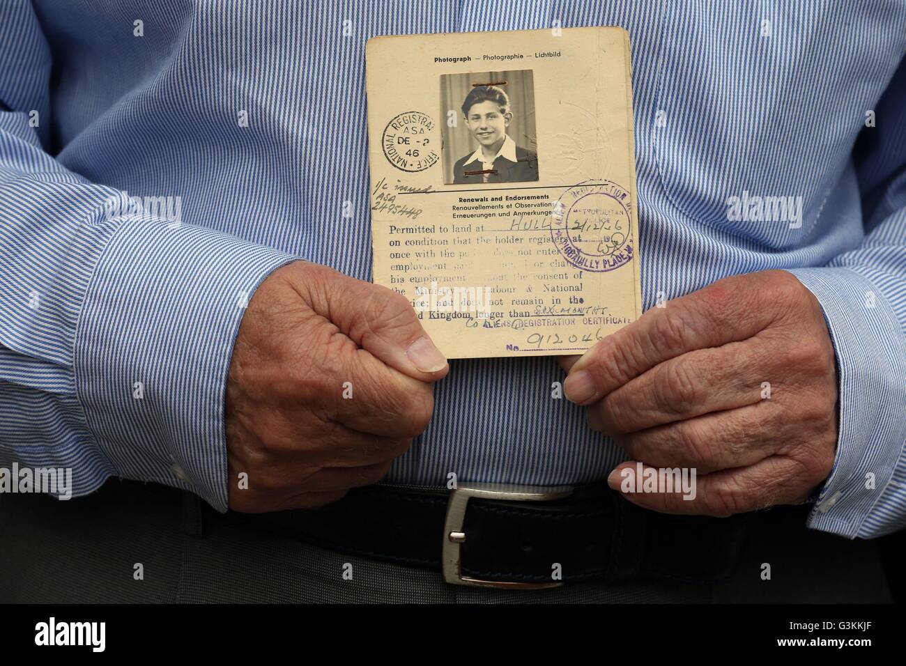 Holocaust survivor Zigi Shipper holds his entry passport from 1946 at his home in Bushey, Hertfordshire. The 86 year old who has spent his retirement sharing harrowing wartime experiences with British schoolchildren is to feature in a 'time capsule' documentary designed to ensure the horrors of Auschwitz are never forgotten. 25/5/2016 Stock Photo