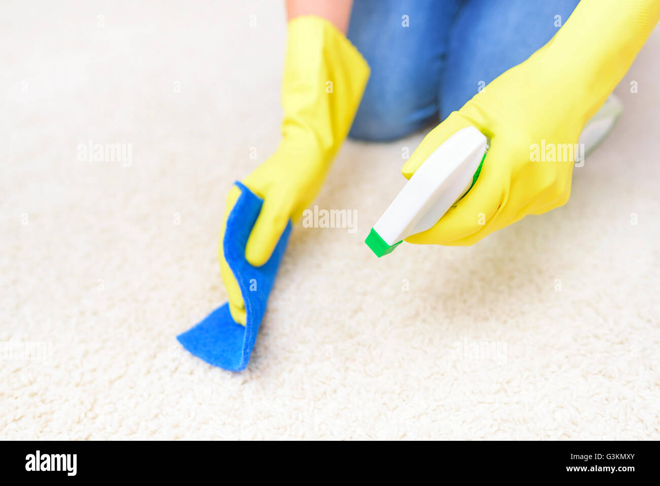 Carpet Cleaning spray. Close-up. Focus on the hand with a spray. Stock Photo