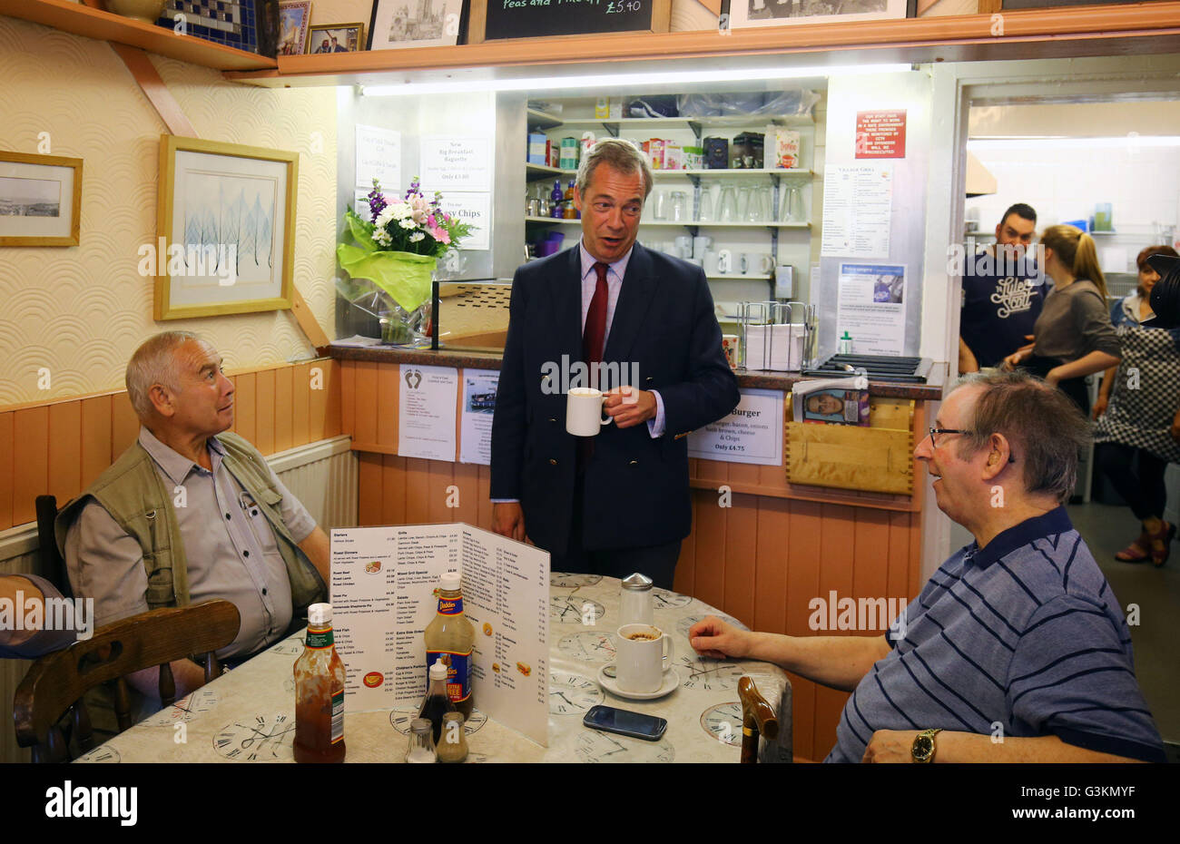 Ukip leader Nigel Farage has a cup of tea whilst speaking to members of the public in the Village Grill in Ramsgate during his party's referendum bus tour. Stock Photo