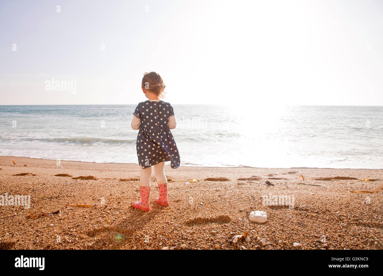 Girl enjoying beach, Man O'War Beach, Dorset Stock Photo
