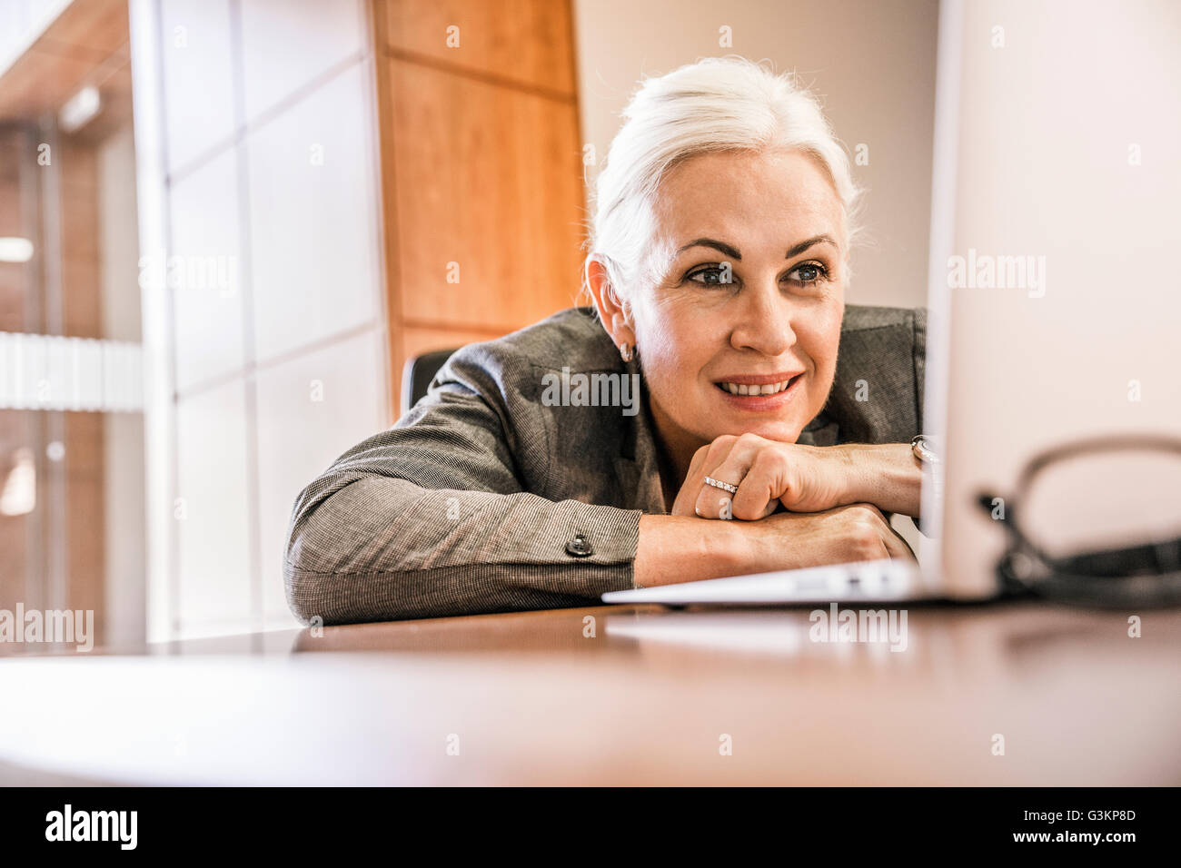 Head leaning on hands hi-res stock photography and images - Alamy