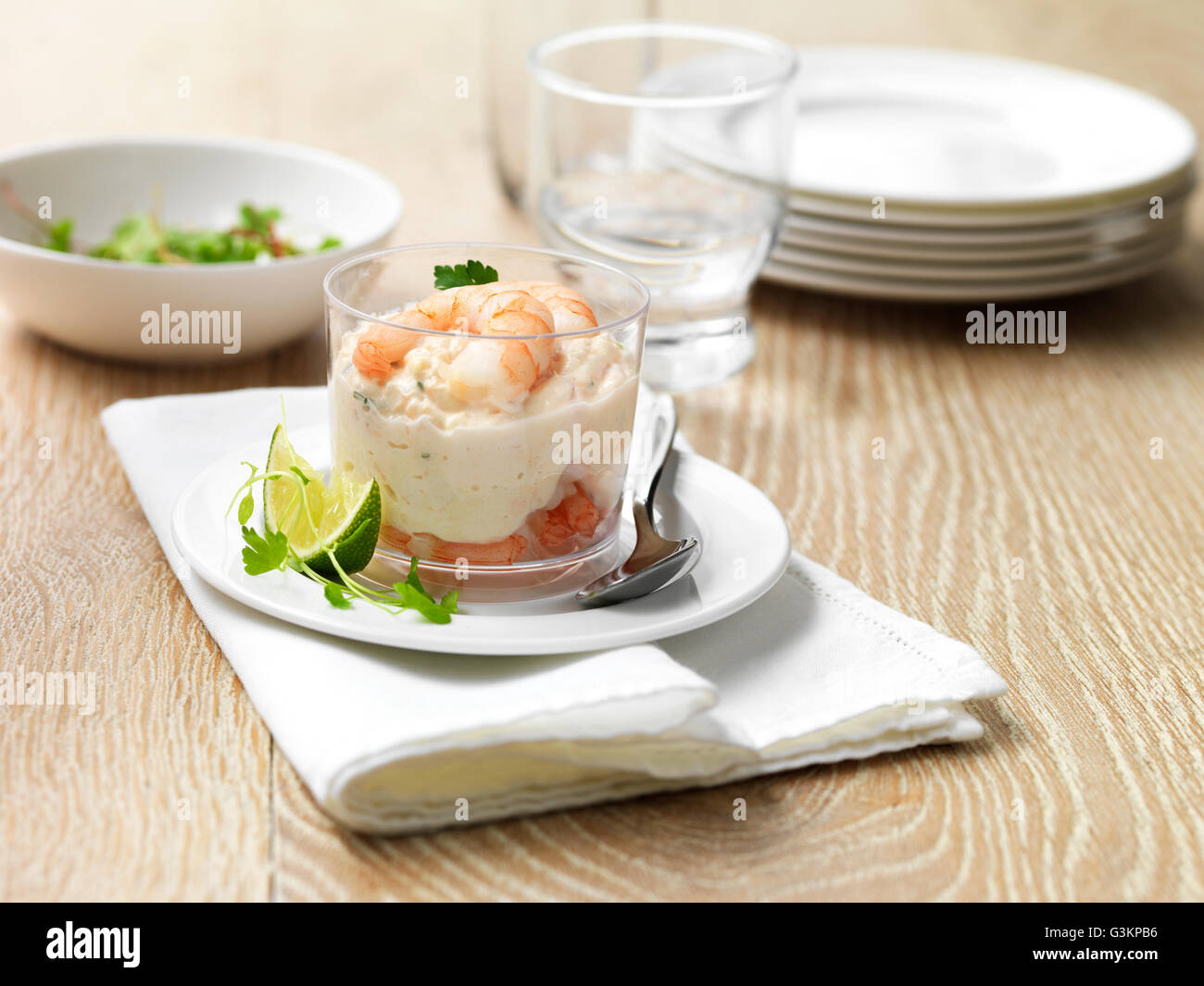 King prawn and salmon starter with lime wedge Stock Photo