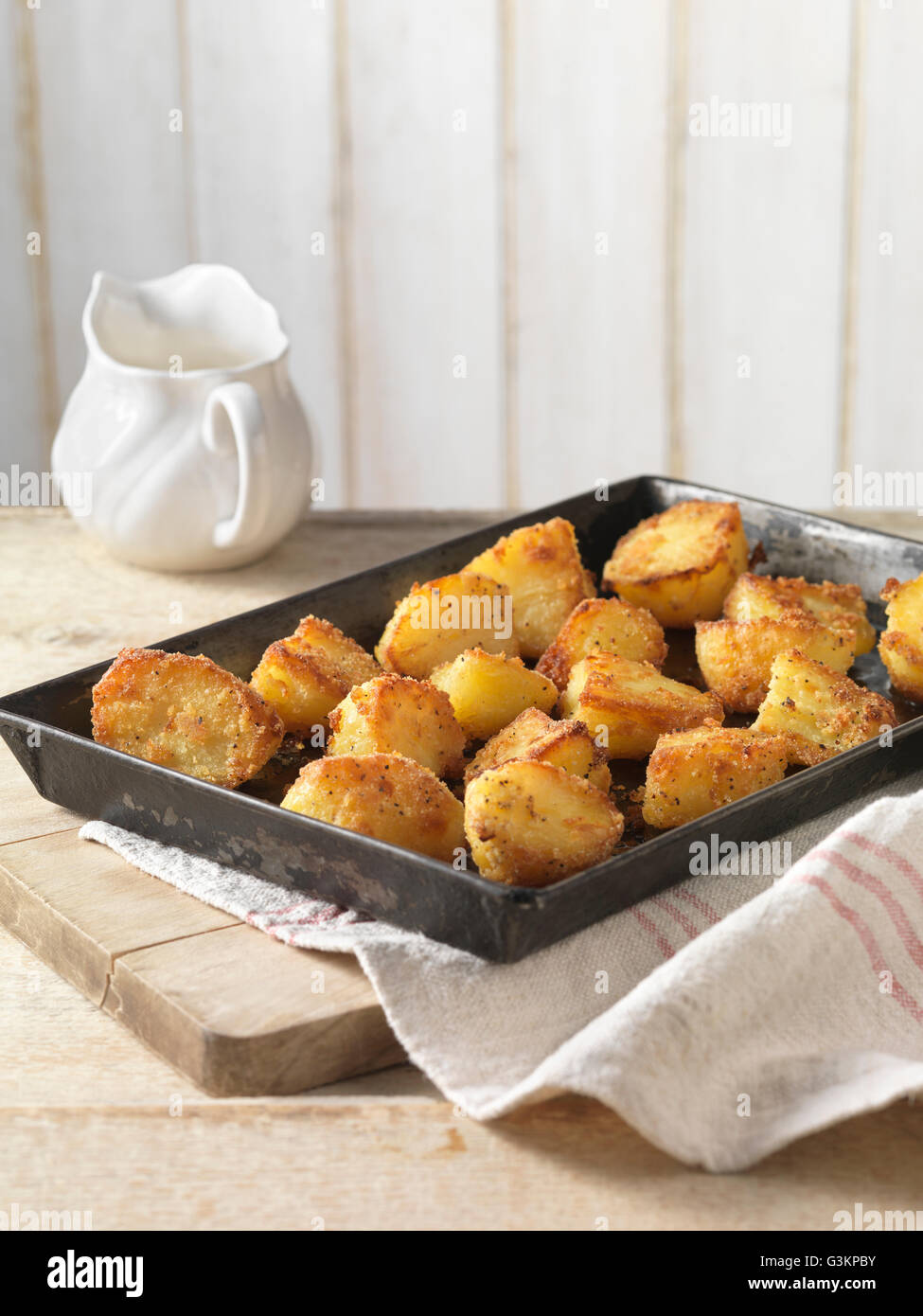Roast potatoes with crispy seasoning in tray Stock Photo Alamy