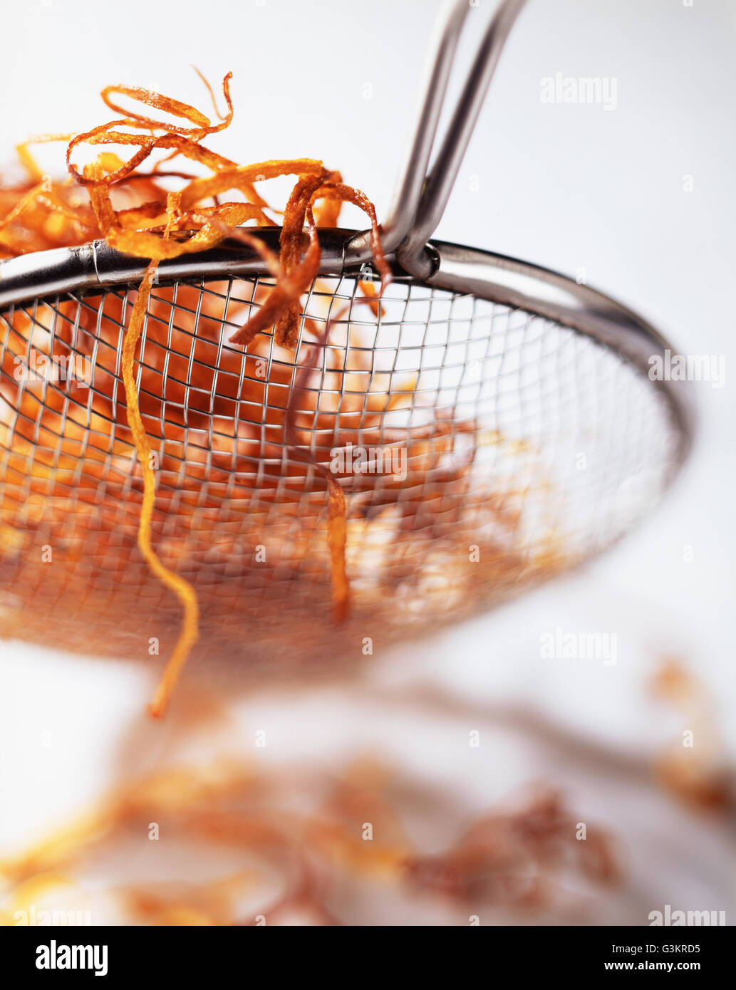 Deep fried carrot in sieve, closeup Stock Photo Alamy