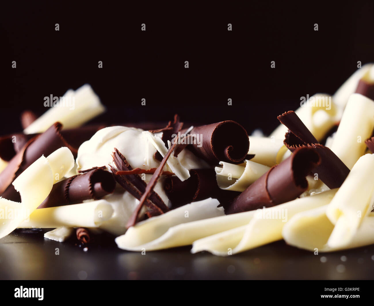 White, dark and milk chocolate curls Stock Photo