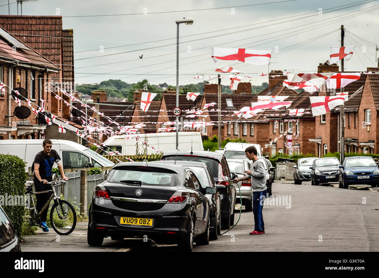 England flags are strung across Torrington Avenue in the Knowle West area of Bristol as residents support England during the Euro 2016 football tournament in France. Stock Photo