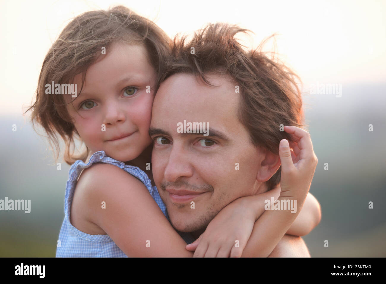Portrait of girl hugging father, Buonconvento, Tuscany, Italy Stock Photo
